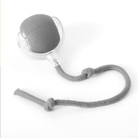 Placeholder: rolling ball dog toy with clear housing and knotted rope tail, black and white photo
