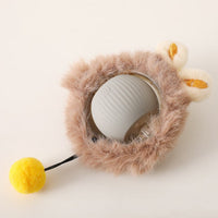 Placeholder: grey rolling ball dog toy in tan plush cover with ears and yellow pom-pom tail