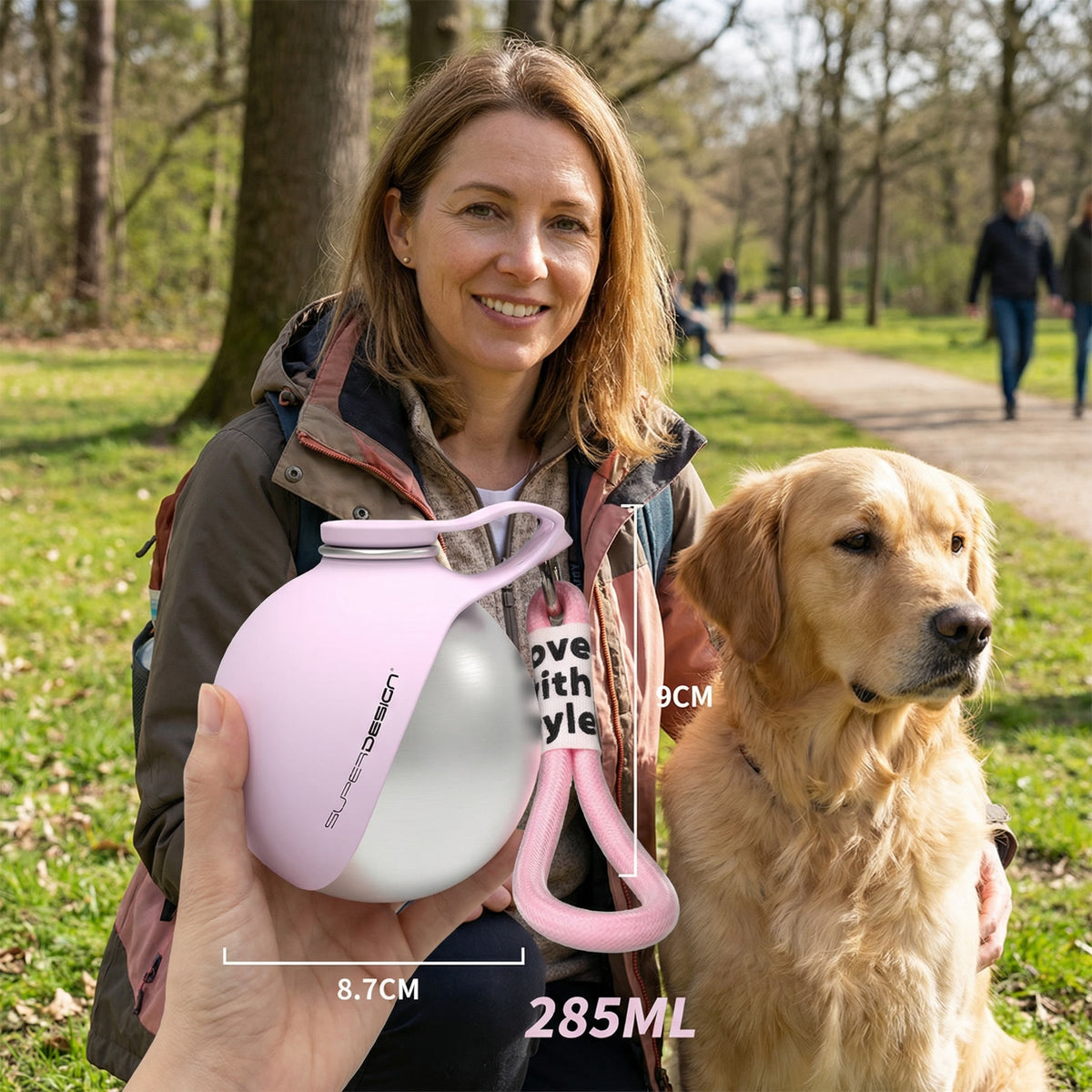 Placeholder: woman and golden retriever in a park with pink stainless steel travel water bottle