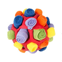 Placeholder: red snuffle ball dog toy filled with multicoloured fleece strips
