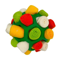 Placeholder: green snuffle ball dog toy filled with red, yellow and white fleece strips