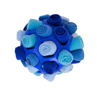 Placeholder: blue snuffle ball dog toy filled with blue fleece strips